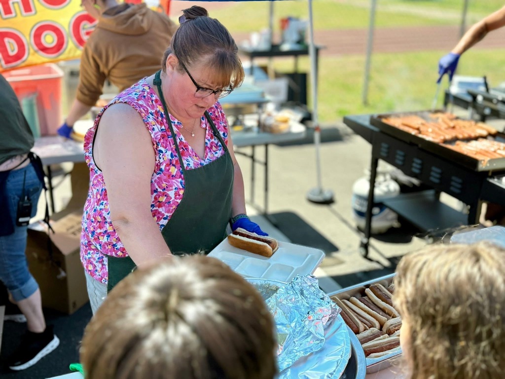 Katie Beebe one of our fantastic lunch ladies serving hot dogs!
