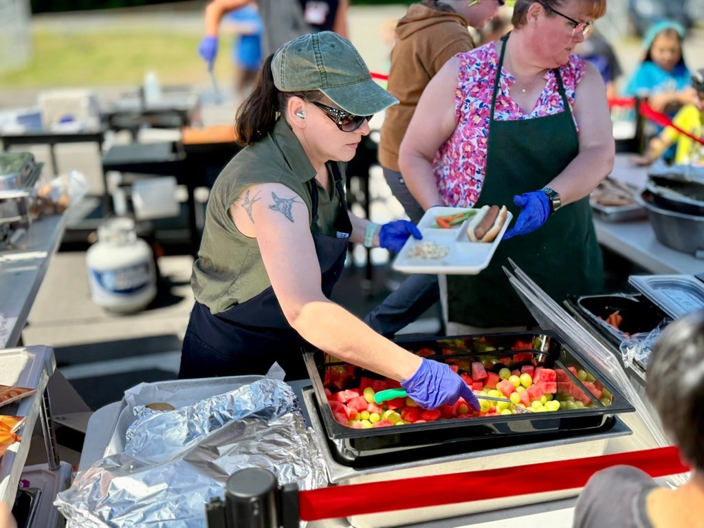 Becky Purvis and Katie Beebe couple of our fantastic lunch ladies serving lunch outside at field day!