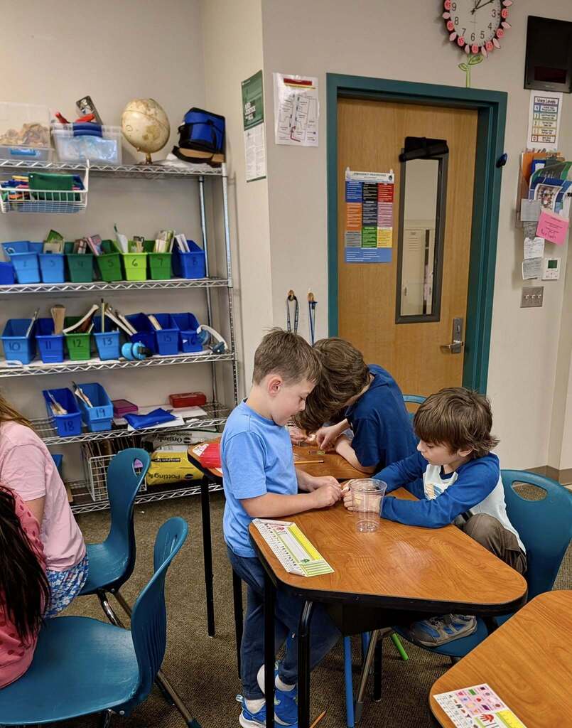 Three 2nd grade students enjoying their time in 3rd grade.