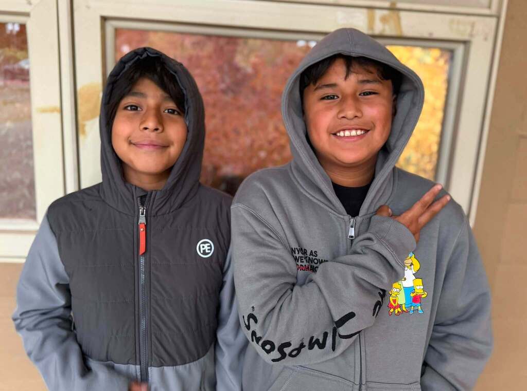 Two friends also happy to be back together at school.