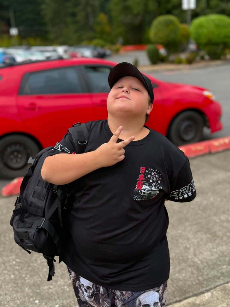 This student saying hello! First day and ready to start the new school year.