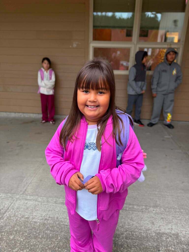 She is so excited to be here. Wearing her pink outfit ready for the 1st day!