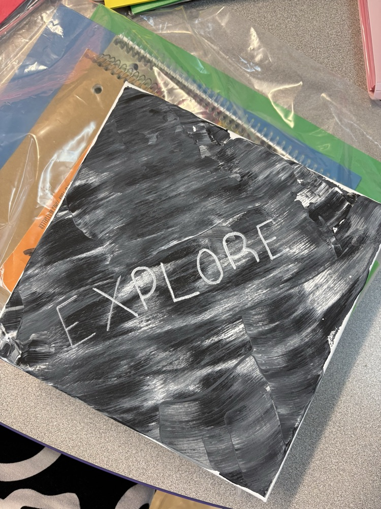 black and white canvas with the word “explore"