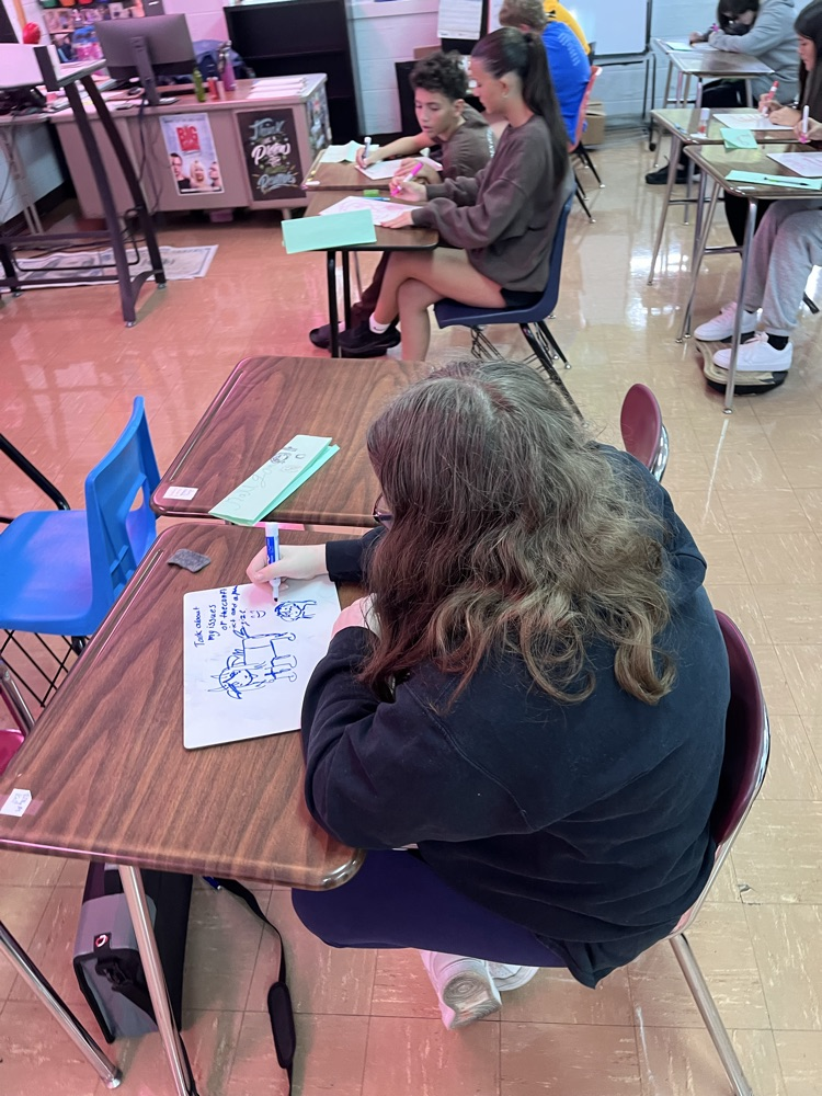 students drawing a picture of how to handle our storms like the bison 