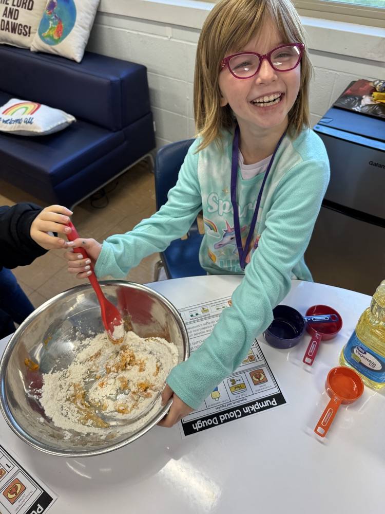 middle school girl mixing her cloud dough