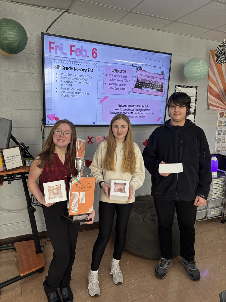 Student award winners with trophy