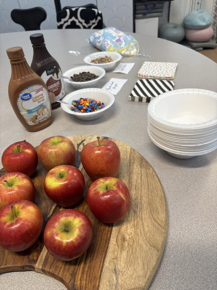 Apples and various toppings for students to create a treat  