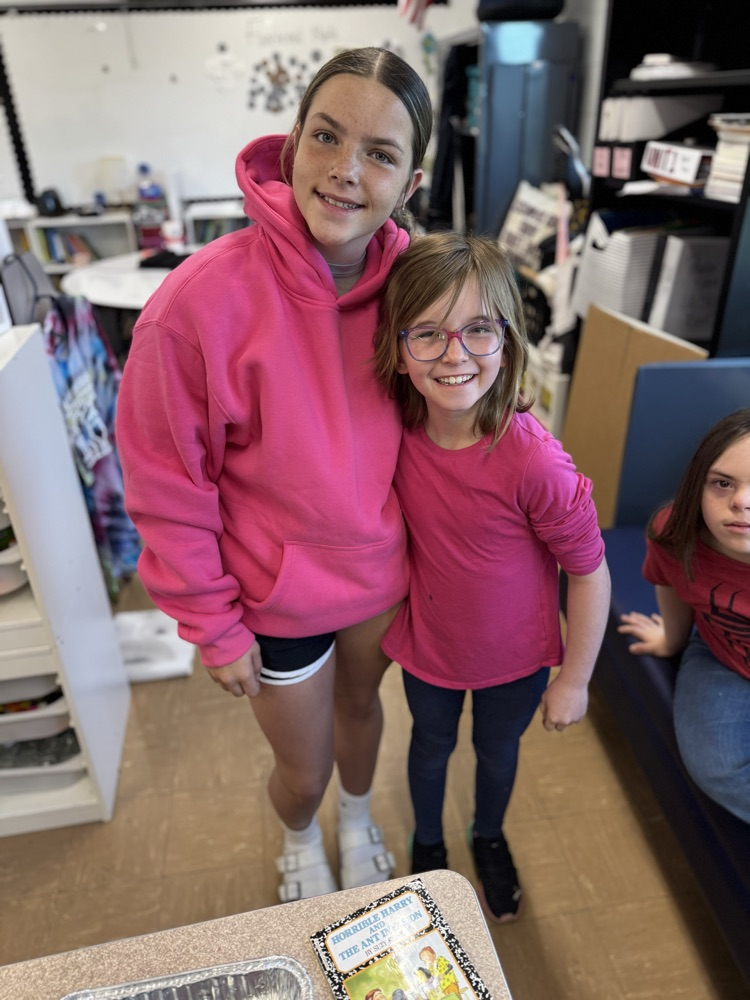 two middle school girls in pink 