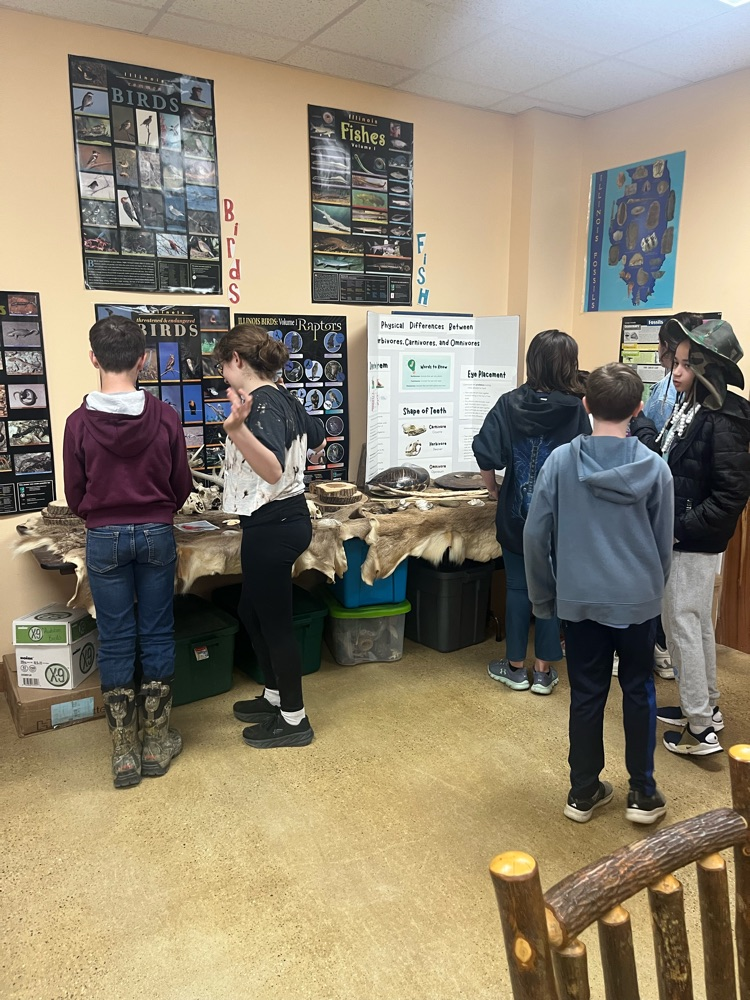 The class of Mrs. Gaddis and Mrs. Turner had day 1 of Outdoor School today. we went for a short hike before the rain and saw some frogs, geese, snails, and a blue heron. This afternoon we were able to check out the animal pelts and some other items