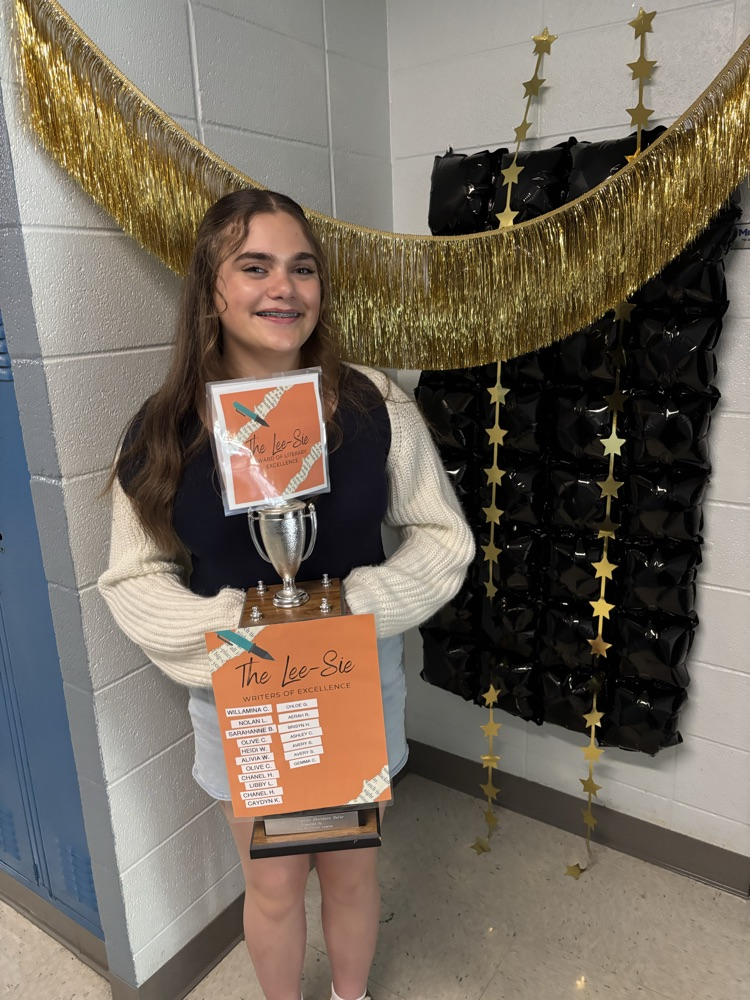 Gurl holding trophy  