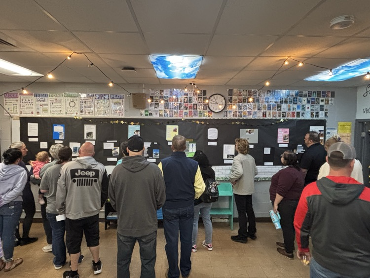 Parents and staff viewing poetry  