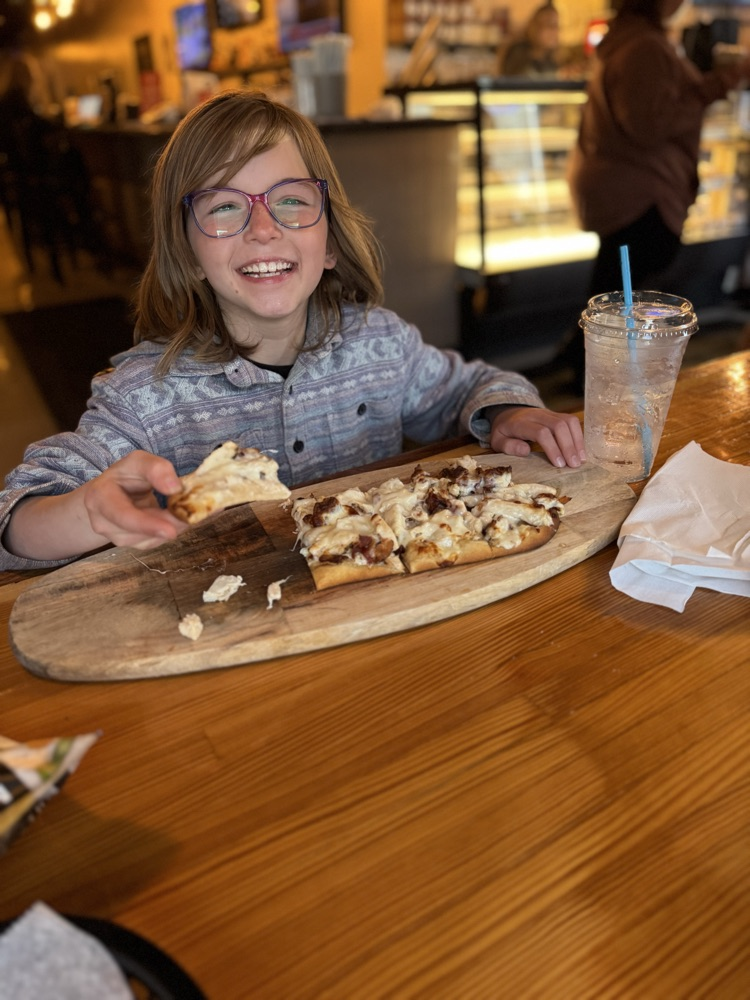 Student with flatbread pizza 