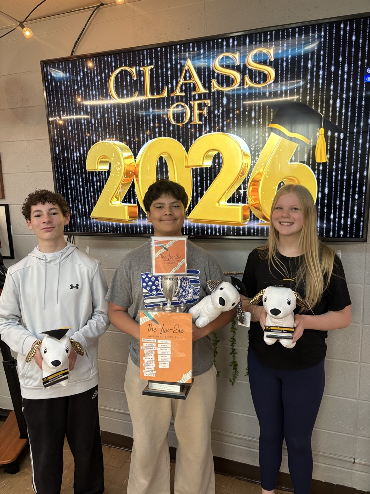 Students holding awards  
