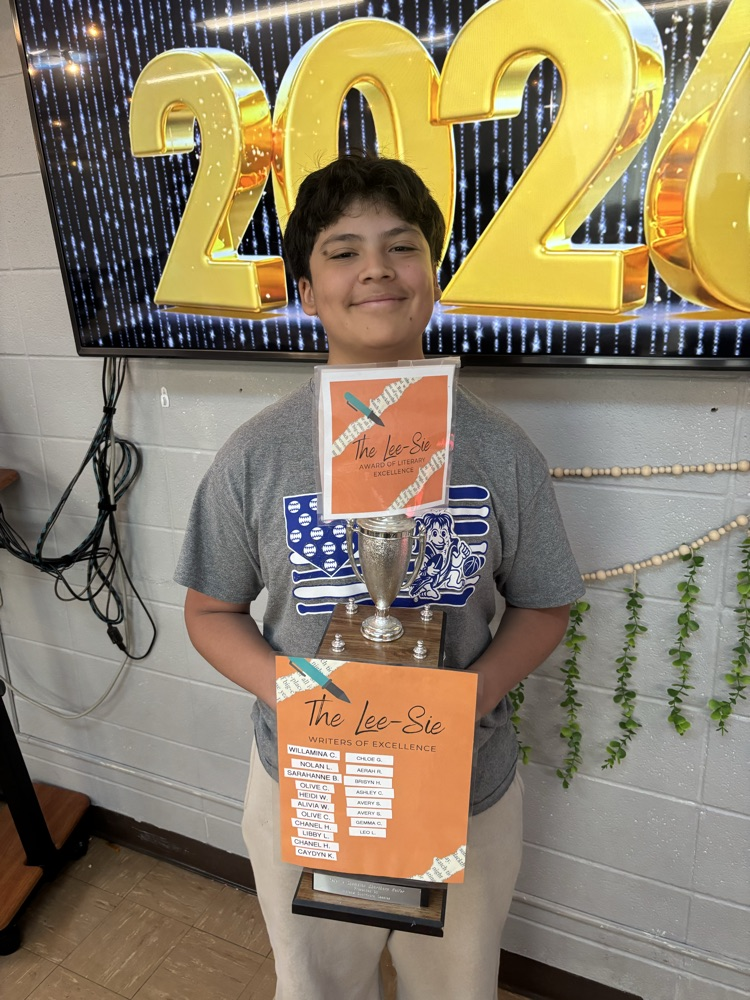 Student holding a trophy  