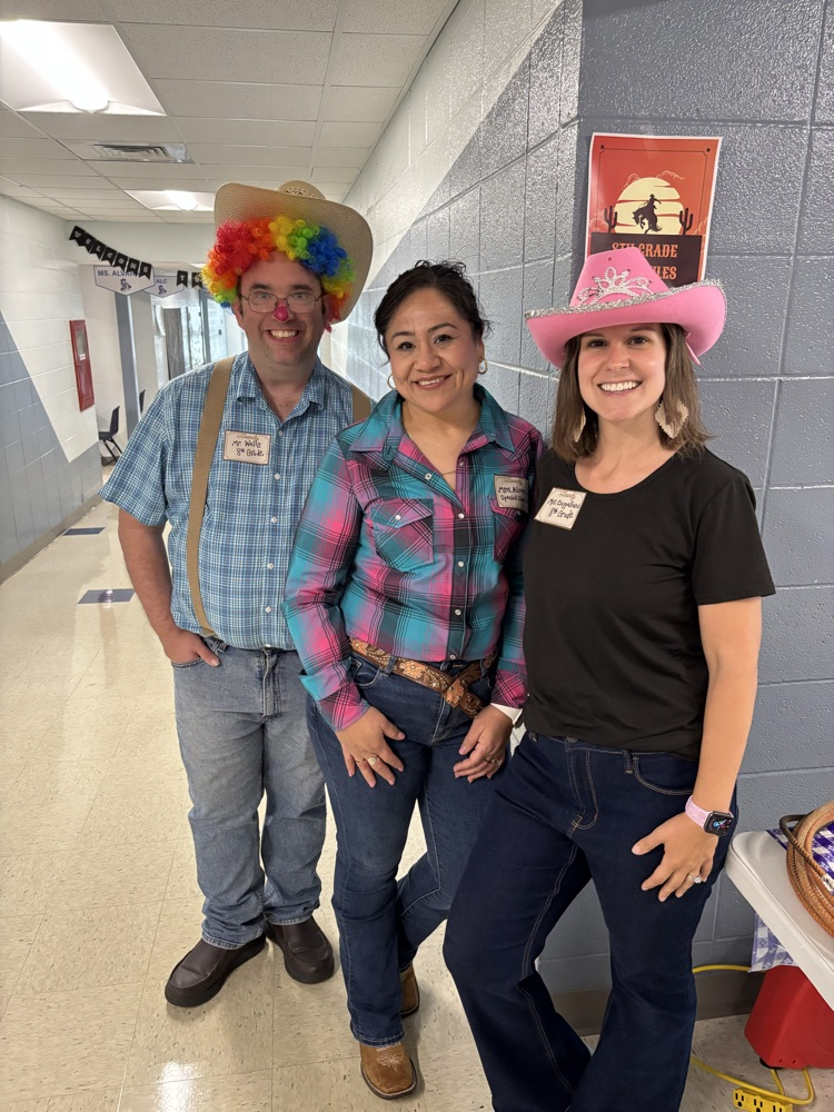 Teachers dressed as cowgirls and rodeo clown