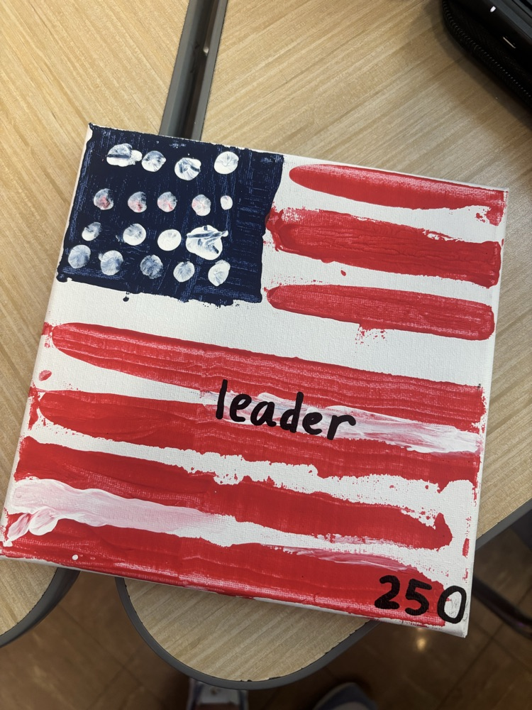 canvas with “leader” painted on it