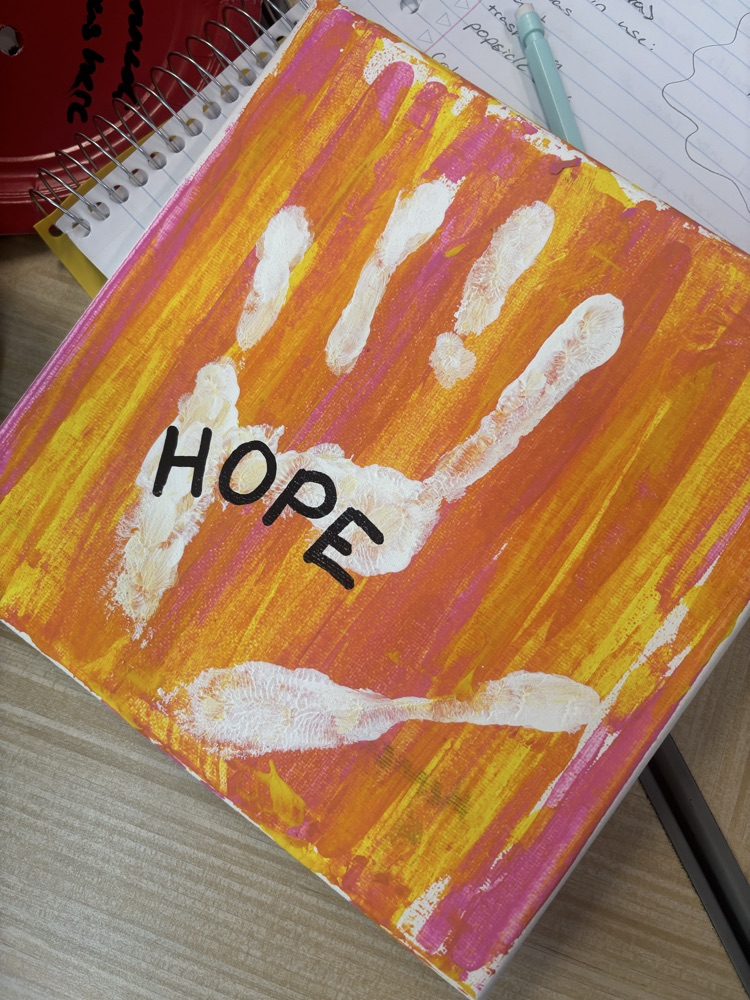canvas with “Hope” painted on it