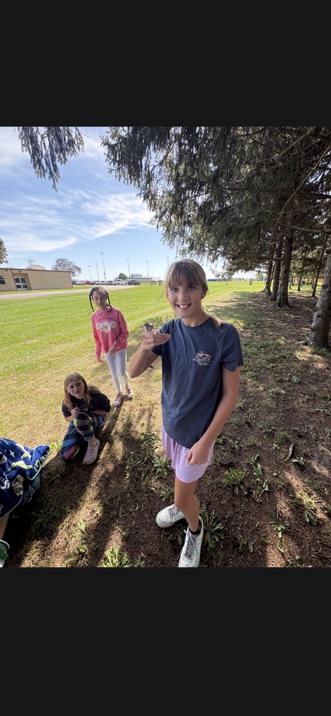 Student holding butterfly