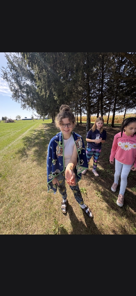 Student holding butterfly