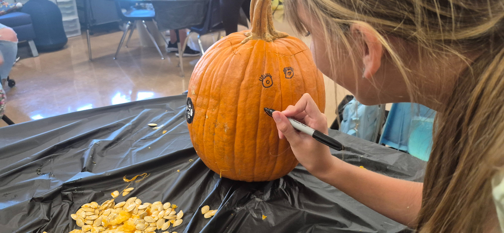 Drawing pumpkin face to carve