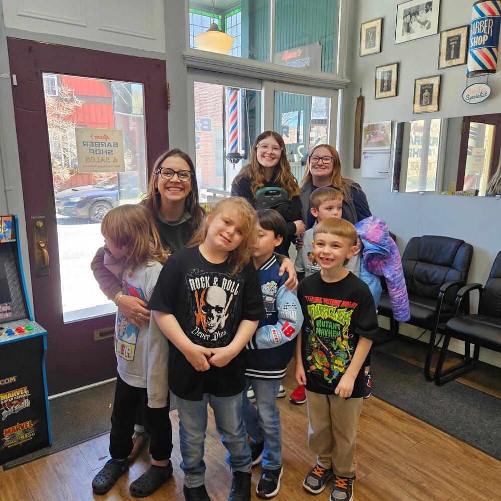 Elementary teacher Mrs. Cross has some exciting news to share with everyone. Her students have been going on “community integration field trips” to explore some of the community helper roles they have been learning about in the classroom. On their first trip, they visited a barber shop where the kids got to wait their turn, sit in a chair, wear the cape, and get their hair combed. Next they walked to the post office where each student purchased their own stamp, and mailed themselves a self portrait! On their second trip they visited the Hoosick Falls Library, where they got to explore the children's room. They played with toys, read books, and went home with a bookmark with the library hours on it so they could return with their families! They have a few more trips to look forward to before the year is over. Thanks for sharing, Mrs. Cross!