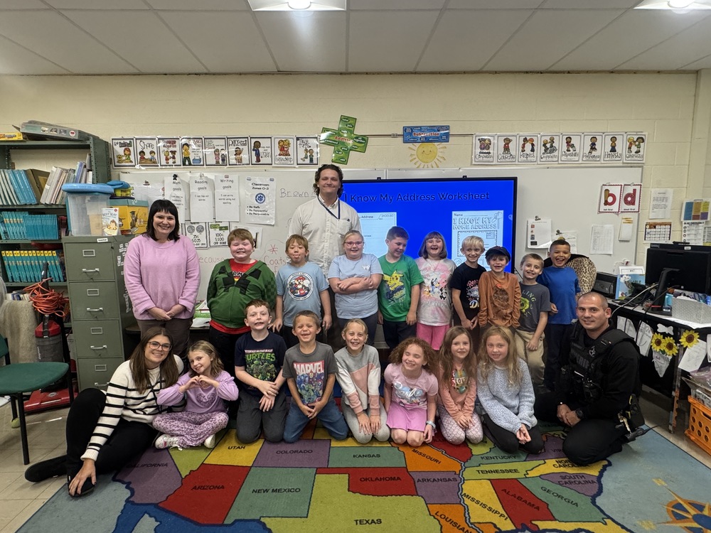 Recently, our School Resource Officer (SRO), Deputy Garhartt, visited second-grade classrooms for an important presentation. Deputy Garhartt spoke with students about what a property’s '911 Address' is, and why it is so important for emergency responders to be able to locate you during an emergency. Students had the opportunity to ask questions, to think about why they should memorize their own addresses, and who it would be safe to share an address with. Deputy then handed out practice sheets so that the students could learn the parts of their own addresses, and practice writing them out to work towards memorizing them. The students are always excited to have a visit from our SRO, and this exercise was a prime example of how Deputy Garhartt collaborates with our teachers and staff to help spread important safety messages to our students. Thank you, Deputy Garhartt, for caring about our students and helping keep them safe!🚓🐾