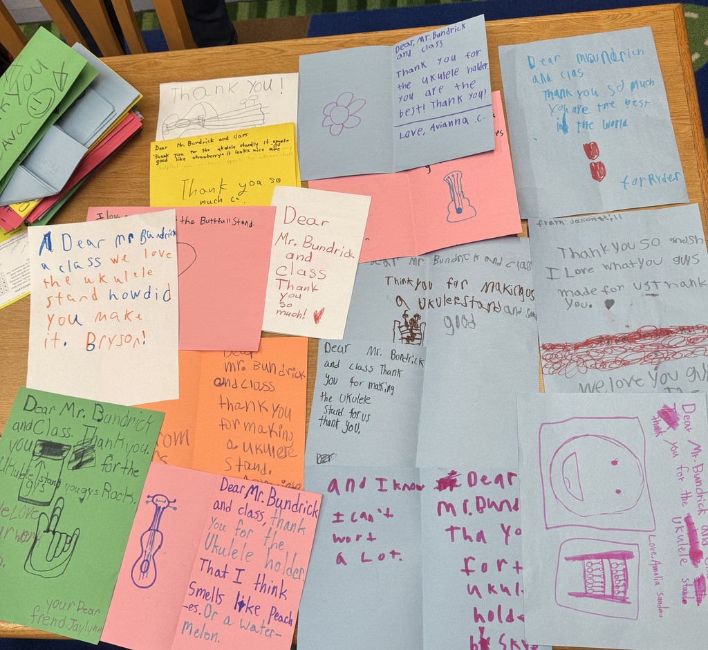 Mr. Bundrick's high school construction class recently had a fun and practical project. The students made a ukulele stand for Ms. Murphy's elementary school music room. The elementary students were so impressed that they made thank-you cards for Mr. Bundrick and his students, to show their appreciation. The stand came out great! 🔨It is so nice to see these students bringing ideas to life, and inspiring our younger students!🎸