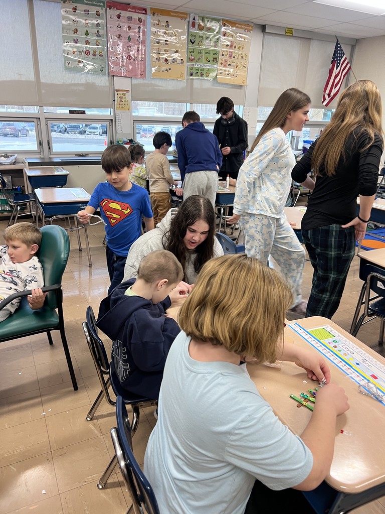 NJHS students make ornaments with second grade
