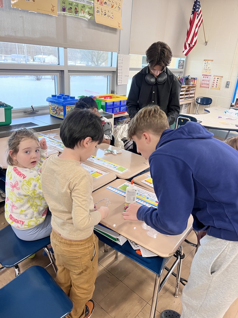 NJHS students make ornaments with second grade