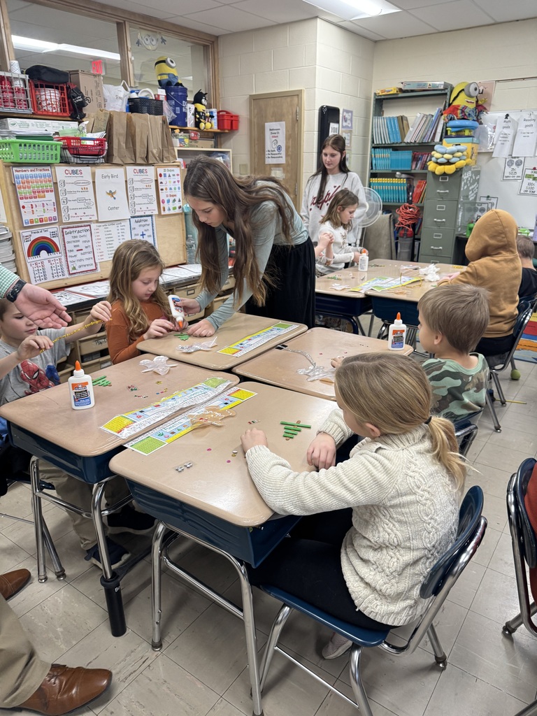 NJHS students make ornaments with second grade