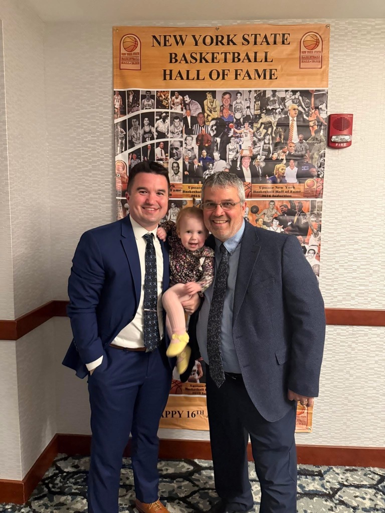 On Sunday, April 19, 2026, the New York State Basketball Hall of Fame inducted its Class of 2026 at a ceremony held at the Hilton Garden Inn in Troy, NY. Among the distinguished honorees was Coach Mike Lilac Jr., longtime Varsity Basketball and Baseball Coach at Hoosick Falls.  Coach Lilac joins an elite class of NYS basketball inductees, including three-time NBA champion and NCAA champion, Danny Green and Yale University's all-time winningest coach, James Jones. Coach Lilac was introduced by Rodger Wyland, News Channel 13's Sports Director and host of Big Board Sports. Some of Coach Lilac's accomplishments include being the Wasaren Leagues All-time winningest Basketball Coach with 462 wins, and over 400 wins for Varsity Baseball.