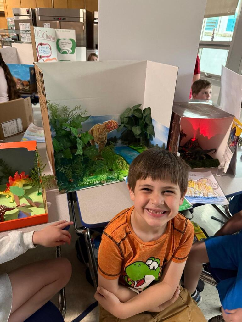 🦖Last week, second graders had their annual Dinosaur Museum Day! Students chose a dinosaur to research, made a report in school, and then continued the learning at home and created a presentation. Elementary students from the other grades had the chance to come through the "Museum" and hear from the students about their projects, and then friends and families got to join in the fun, too. Great job to the second-grade team, and thanks for sharing your photos! Dino Day is always a roaring success!🦕
