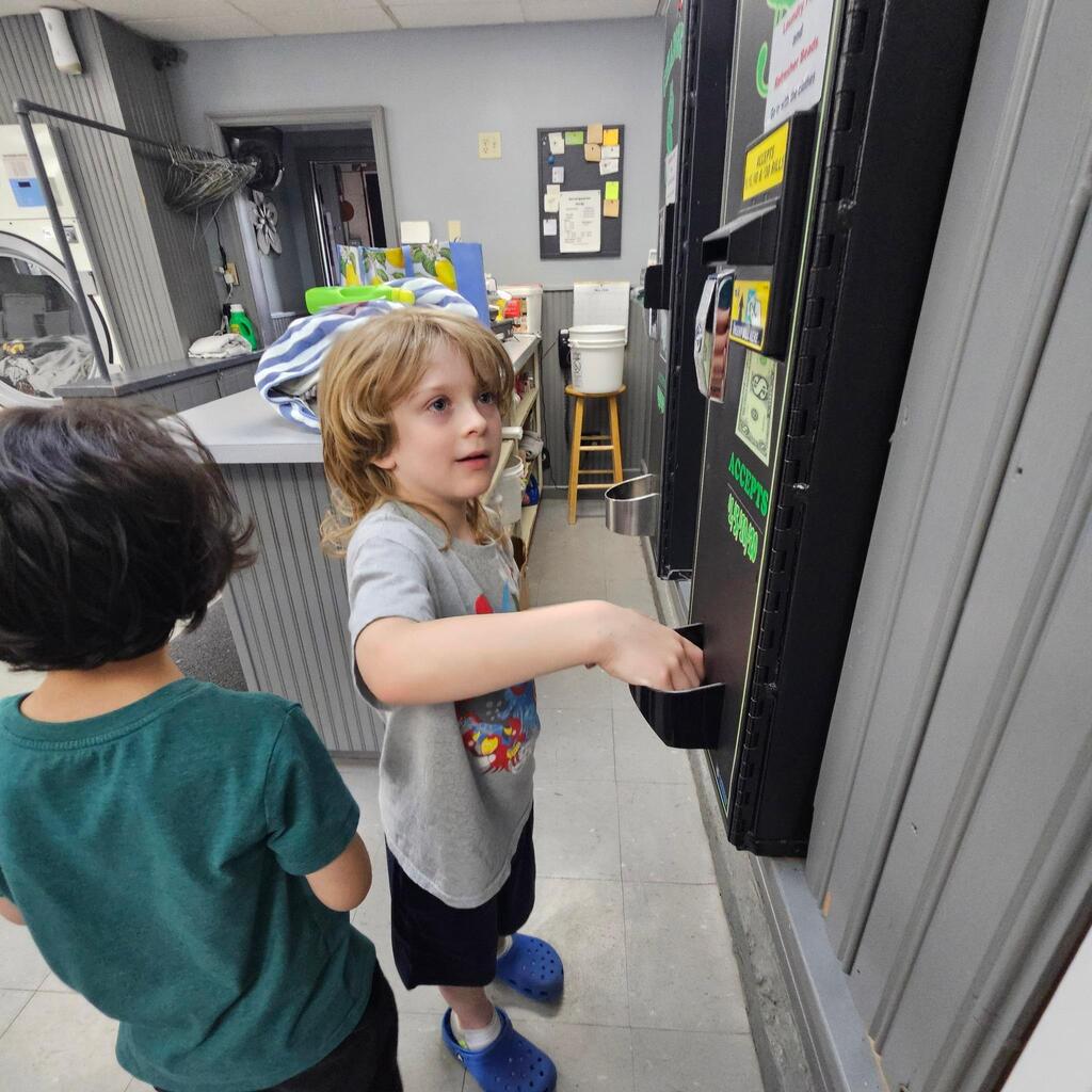 Elementary teacher Mrs. Cross has another “community integration field trip” to share! These trips allow students to explore some of the community helper roles they have been learning about in the classroom. Students visited the laundry mat in the Village! The kiddos made change, put coins into the washer, poured detergent, and watched the laundry spin! They walked to the store and purchased a drink, and then returned when the wash was done and put the blankets into the dryer. They did a great job, and they had an awesome time out in the community! Thanks for sharing, Mrs. Cross! 