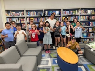 Our Middle School/High School Librarian, Mrs. Antolick, wanted to share highlights from a special day in our library! 📚 On June 12, Hoosick Falls had the honor of welcoming internationally acclaimed young adult author Pablo Cartaya. Throughout the day, he met with our fifth- and sixth-grade students, sharing how our experiences shape our journeys and how we can learn, grow, and find strength through them. Mr. Cartaya also led an engaging writers' workshop, giving students a behind-the-scenes look at his creative process and offering tips for crafting compelling stories. Students were thrilled to meet the author of a book they had been reading, ask thoughtful questions, and have their books signed. Thank you, Mrs. Antolick, for organizing this incredible opportunity and for sharing these wonderful moments with our school community!🐾