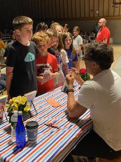 Our Middle School/High School Librarian, Mrs. Antolick, wanted to share highlights from a special day in our library! 📚 On June 12, Hoosick Falls had the honor of welcoming internationally acclaimed young adult author Pablo Cartaya. Throughout the day, he met with our fifth- and sixth-grade students, sharing how our experiences shape our journeys and how we can learn, grow, and find strength through them. Mr. Cartaya also led an engaging writers' workshop, giving students a behind-the-scenes look at his creative process and offering tips for crafting compelling stories. Students were thrilled to meet the author of a book they had been reading, ask thoughtful questions, and have their books signed. Thank you, Mrs. Antolick, for organizing this incredible opportunity and for sharing these wonderful moments with our school community!🐾