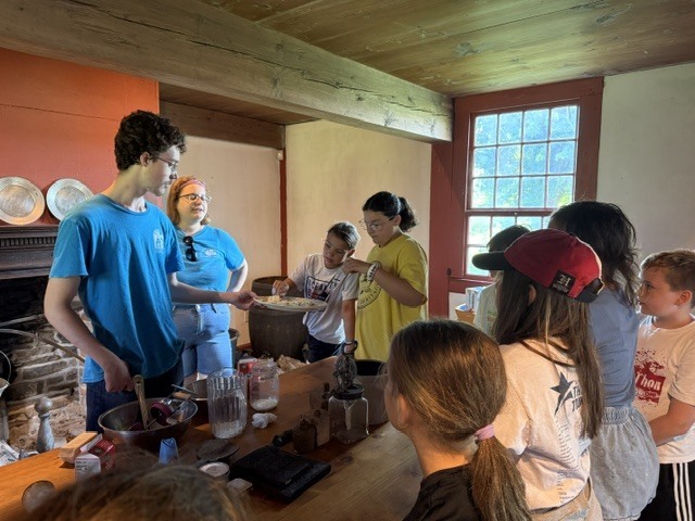 Last Wednesday, Living History Summer Institute students visited Mabee Farm. Mabee Farm was a big hit! The animals, butter churning, grain threshing, and digging potatoes gave them lots of hands-on opportunities to learn about life on a farm in the 18th Century. The kids all did an awesome job! Everyone is ready to be an 18th-century farmer. Thanks for sharing, Mrs. Brownell!