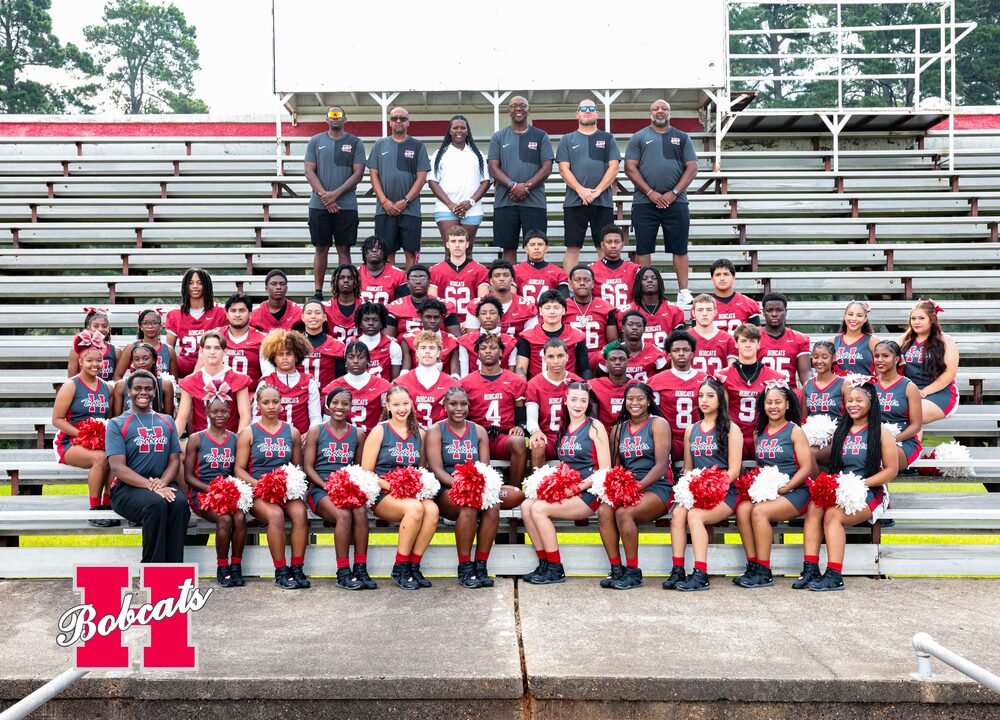 Group photo of the 2026–2027 Hope High School football players, cheerleaders, and coaches posed together on stadium bleachers.