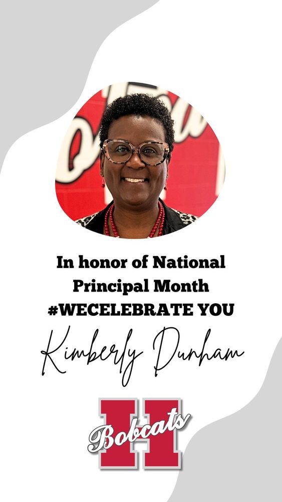 Portrait of Kimberly Dunham smiling and wearing glasses, a black outfit, and red beaded jewelry. The background features a red wall with white lettering. Text on the image reads: ‘In honor of National Principals Month #WECELEBRATE YOU Kimberly Dunham.’ Below is the red and white Hope Bobcats ‘H’ logo.”