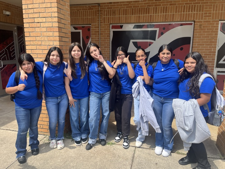 group of girls in blue shirts
