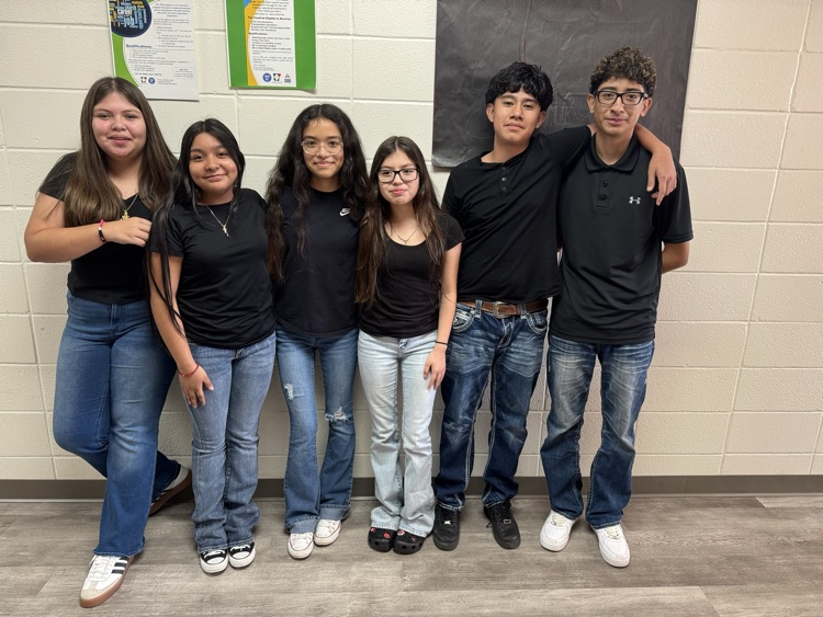 Students in black shirts
