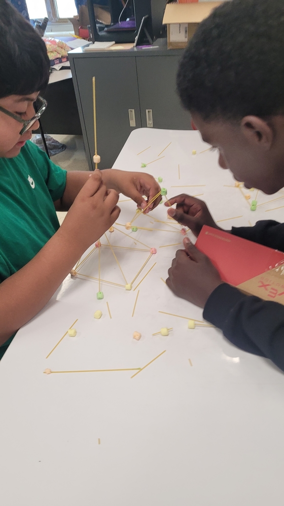 students working together to build a tower