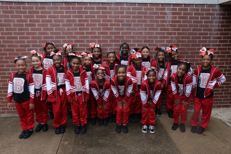 Photos of the Little League Wildcats football team and cheerleaders getting ready for their first game of the season.
