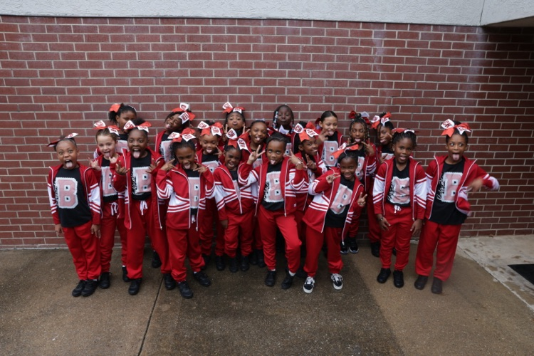 Photos of the Little League Wildcats football team and cheerleaders getting ready for their first game of the season.