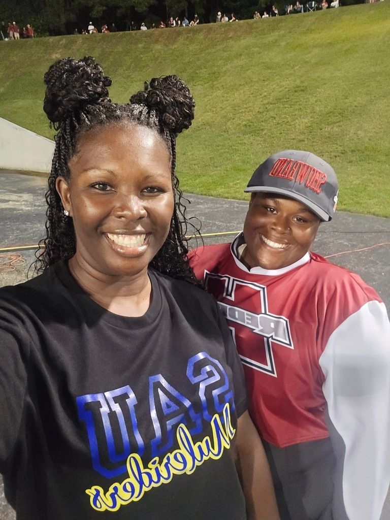 Coach Kirby Bradley and former cheerleader and Hope band member Aliyah Washington