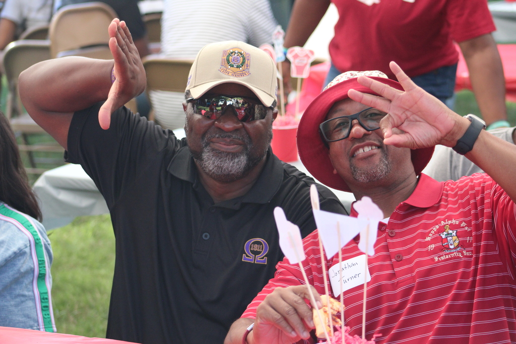 Coach Gordan and Coach Jonathan Turner enjoying college Alma Mater
