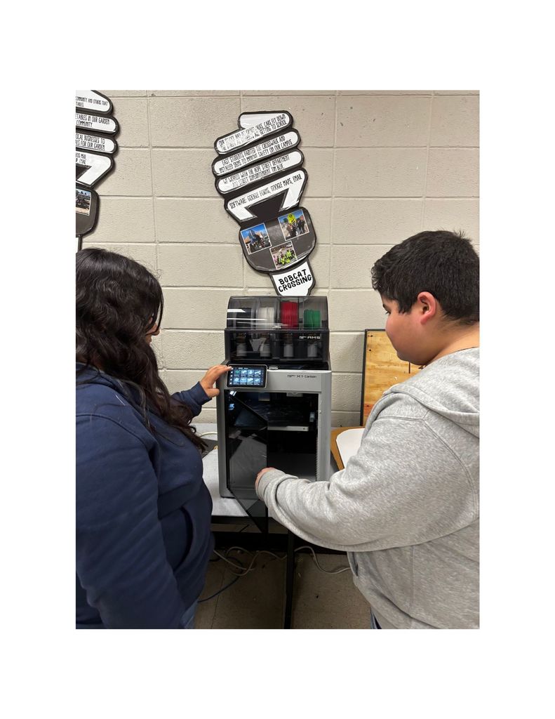 EAST students 3d printing a case handle.