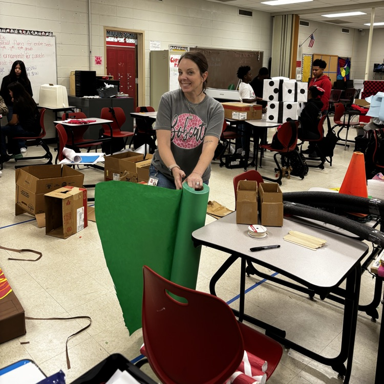 staff helping students work