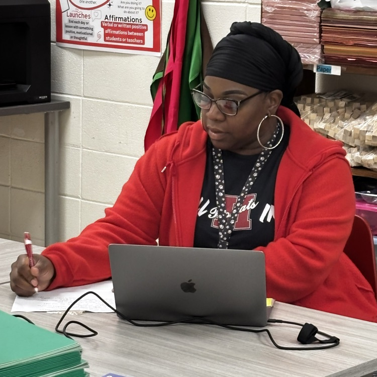 Mrs. Anderson taking notes.
