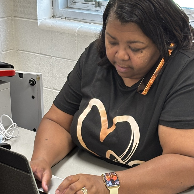 Mrs. Butler is multitasking to prep her next meeting.