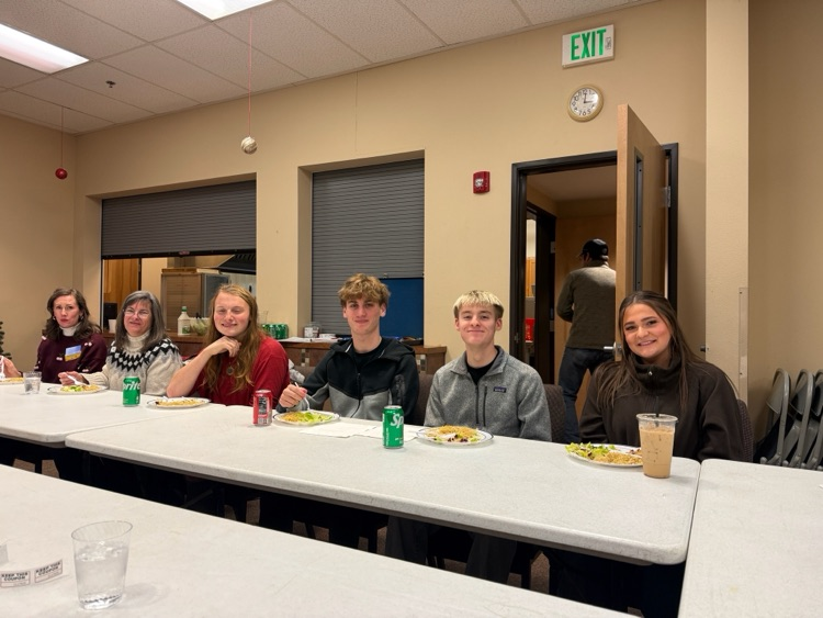 students gathering at a table